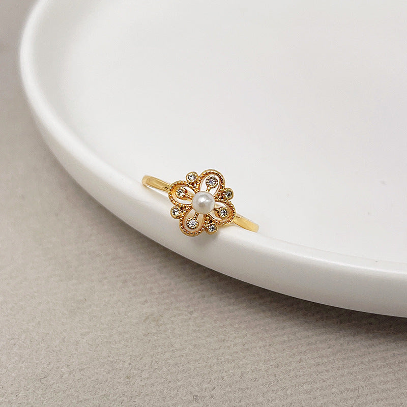 Fashionable temperament pearl four-leaf flower ring